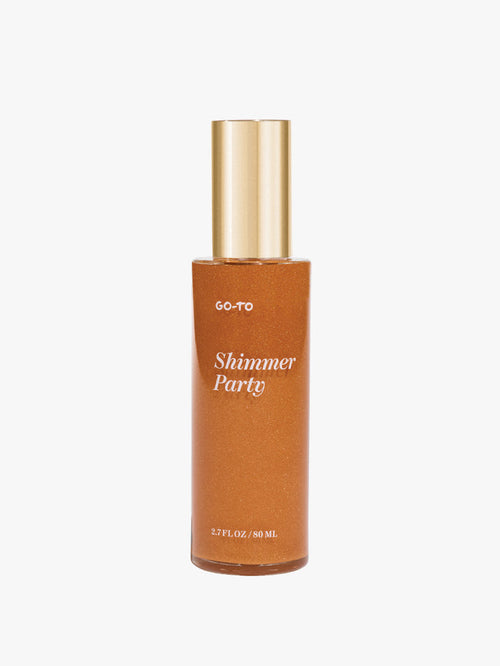 Go To Skincare Shimmer Party body shimmer in an amber bottle with a gold pump cap on a white background